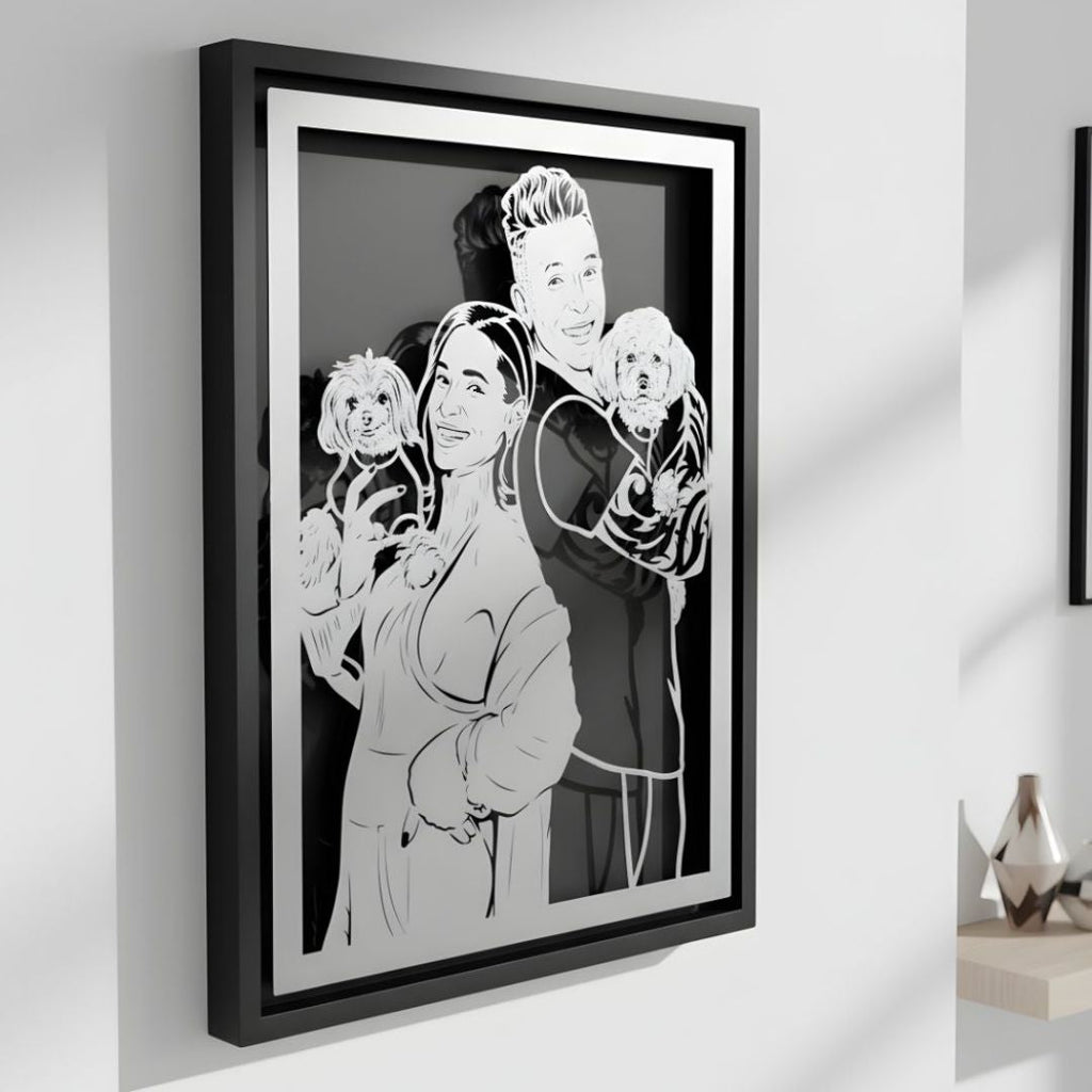 Couple holding their two small dogs, custom metal portrait in a black frame
