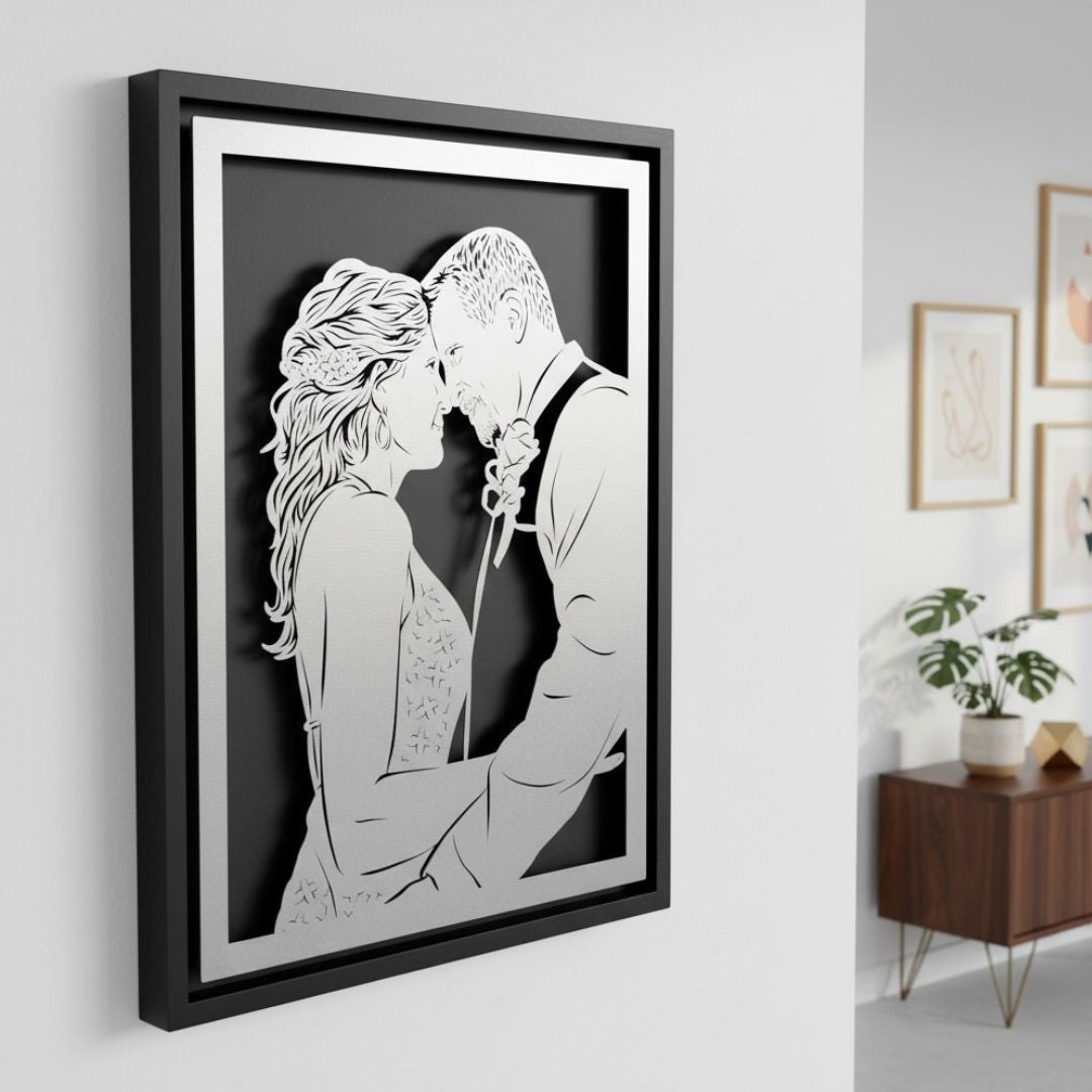 Wedding couple forehead to forehead, silver steel portrait in a black frame