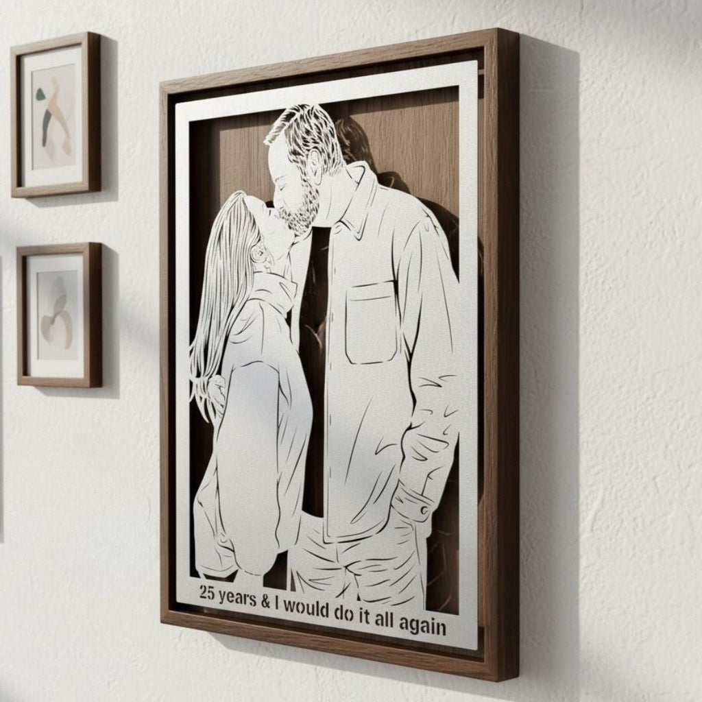 Couple kissing for their 25th anniversary, steel portrait in a walnut frame with their words cut below