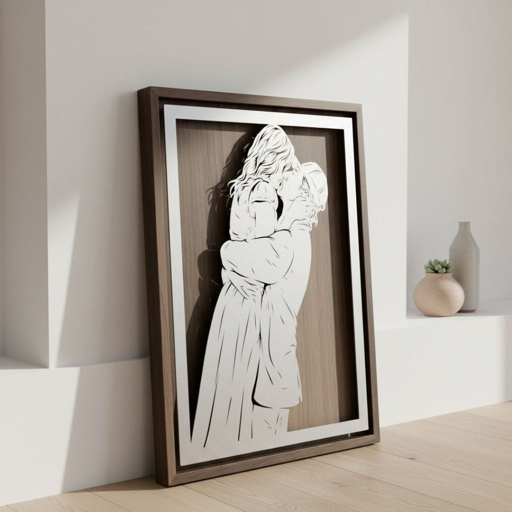 Couple embracing, laser cut steel portrait in a walnut frame