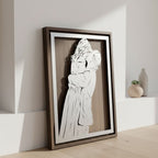 Couple embracing, laser cut steel portrait in a walnut frame