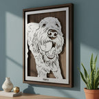 Doodle dog with its tongue out, steel portrait in a walnut frame with its name below