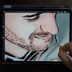 An artist hand drawing a portrait on a tablet before it is laser cut in steel