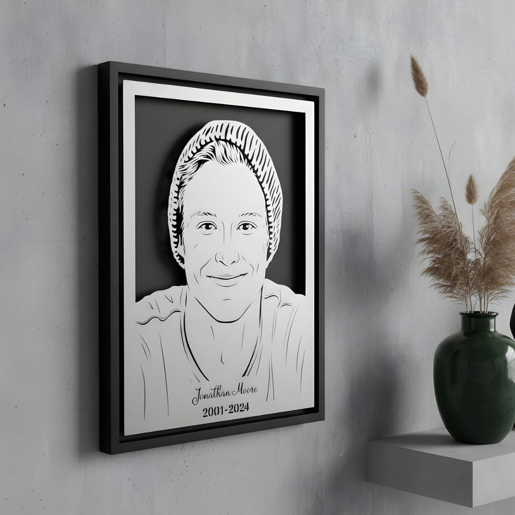 Memorial portrait of a young man in a knit cap, steel in a black frame with his name and years below