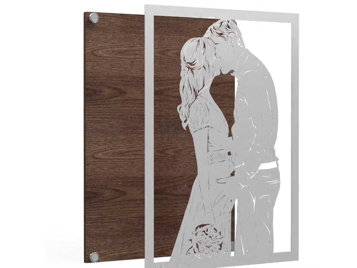 Steel portrait held just in front of the wood board, corners lined up with the four magnets