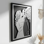 Bride and groom kissing beside her bouquet, steel portrait in a black frame