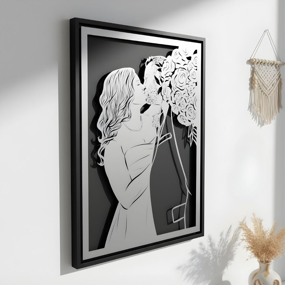 Bride and groom kissing beside her bouquet, steel portrait in a black frame