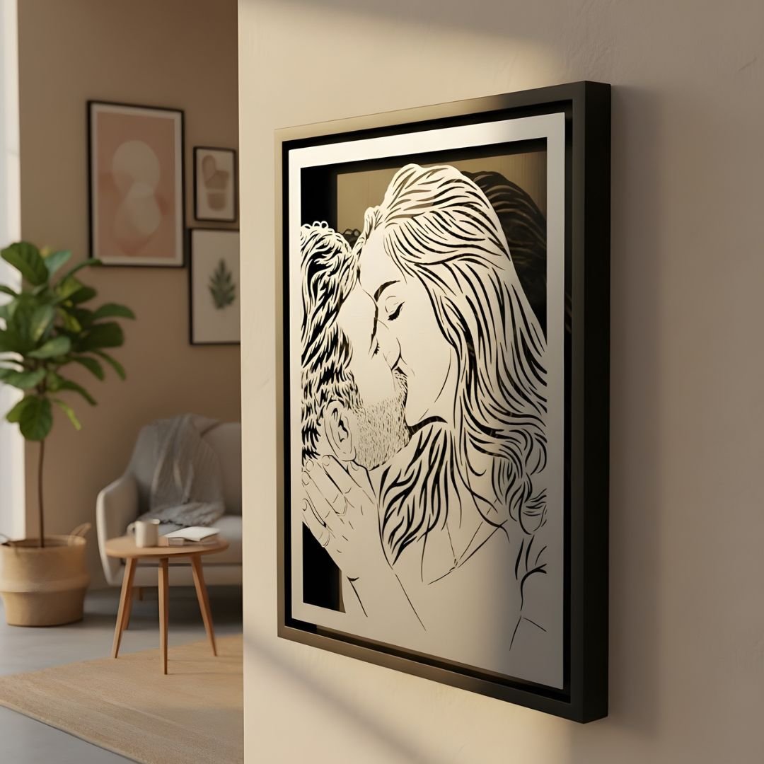 Close-up of a couple kissing, laser cut steel in a black frame